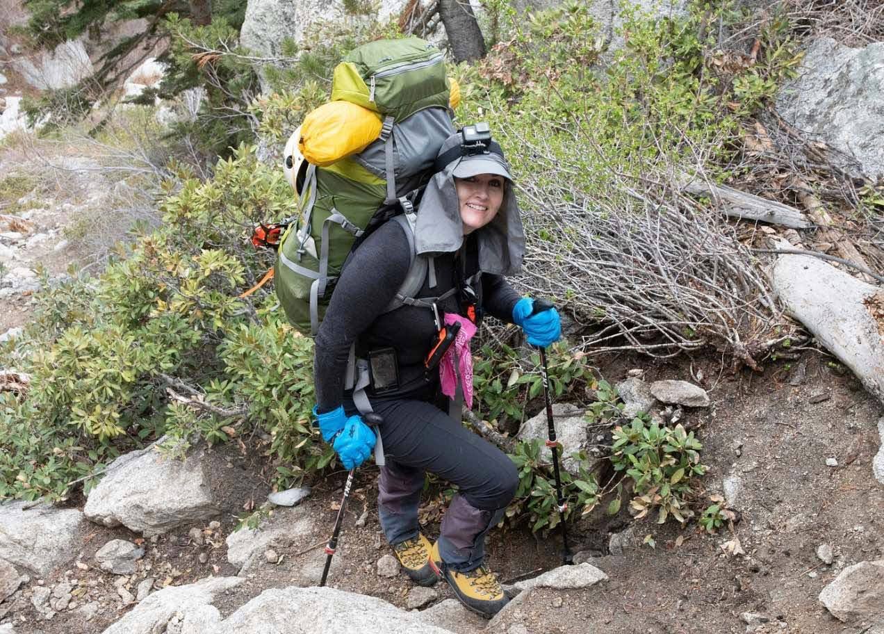 Jenny backpacking with full pack on the trail